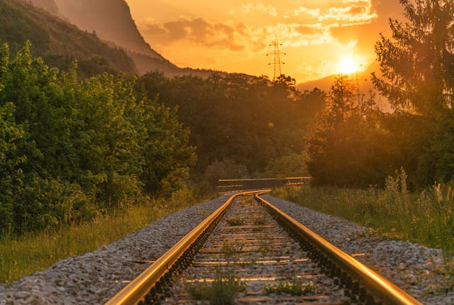 Railway Sunset through the Forest